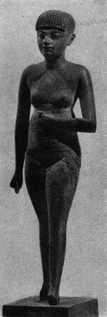 74. Обнаженная девушка. Деревянная статуэтка. XVШ династия. Конец 15 в. до н. э. Париж. Лувр.